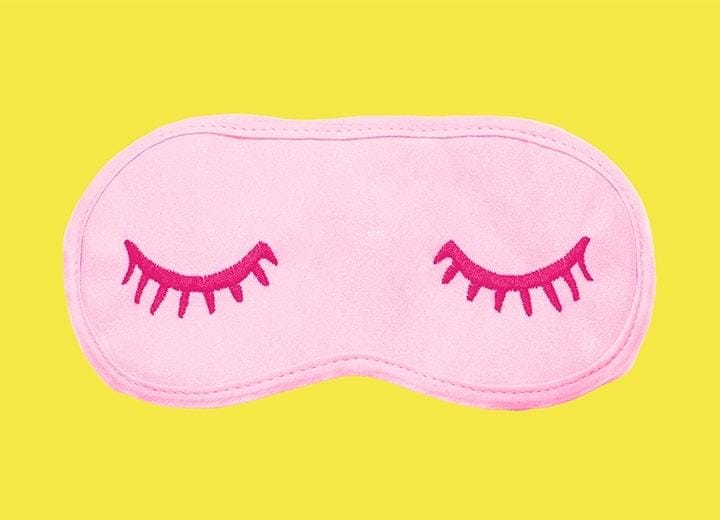 pink sleep mask in front of a yellow mask